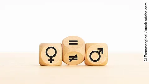 Gendermedizin Holzwürfel mit Gendersymbolen