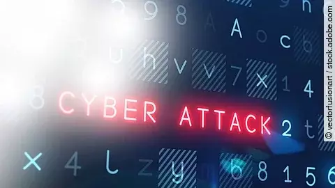 In einem Raster aus blauen Ziffern und Buchstaben leuchtet der Begriff "Cyber Attack" rot auf.