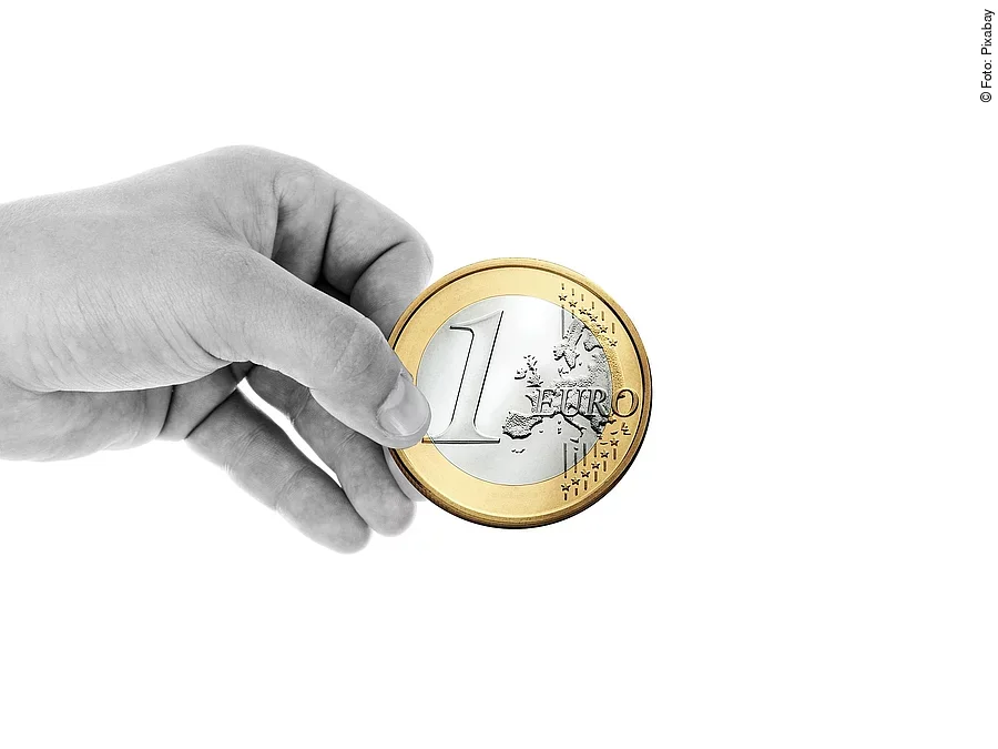 Hand mit Euromünze Hand mit Euromünze