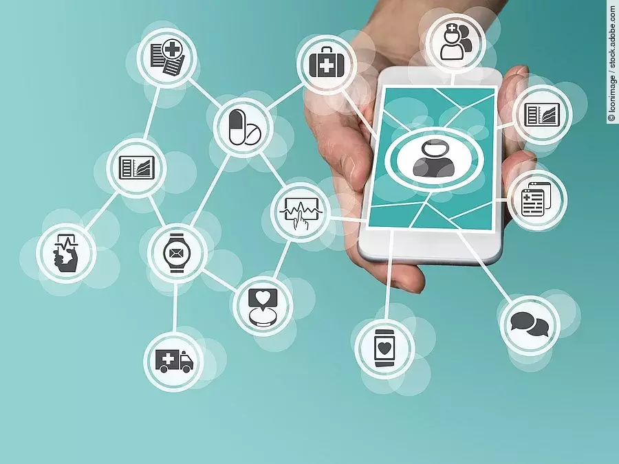 Aus einem Smartphone kommt ein graphisches Netzwerk, das verschiedene Bereiche des Gesundheitswesens zeit: Medikamente, Krankenwagen, Pflege, Dokumente, Arztkoffer und weitere.