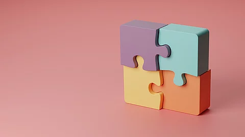 3d-Illustration vier zusammengesetzte verschiedenfarbige Puzzleteile