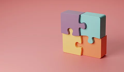 3d-Illustration vier zusammengesetzte verschiedenfarbige Puzzleteile