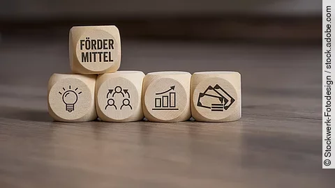 Fördermittel Holzwürfel mit "Fördermittel"-Aufdruck