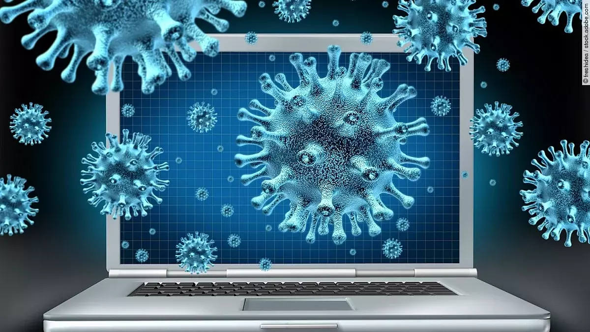 Computervirus Ein aufgeklappter Laptop umgeben von schwebenden Viren (kugelförmige Objekte mit Noppen).