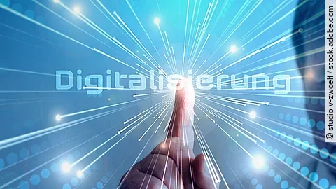 Digitalisierung Grafik mit dem Wort "Digitalisierung" im Mittelpunkt. Lichtstrahlen gehen vom Mittelpunkt aus.