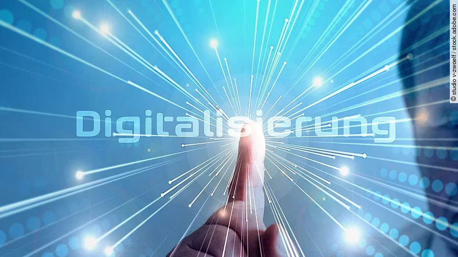Digitalisierung Grafik mit dem Wort "Digitalisierung" im Mittelpunkt. Lichtstrahlen gehen vom Mittelpunkt aus.