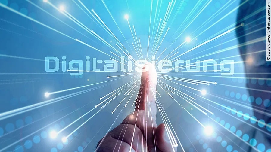 Digitalisierung Grafik mit dem Wort "Digitalisierung" im Mittelpunkt. Lichtstrahlen gehen vom Mittelpunkt aus.