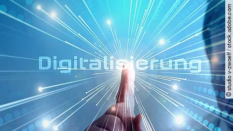 Grafik mit dem Wort "Digitalisierung" im Mittelpunkt. Lichtstrahlen gehen vom Mittelpunkt aus.