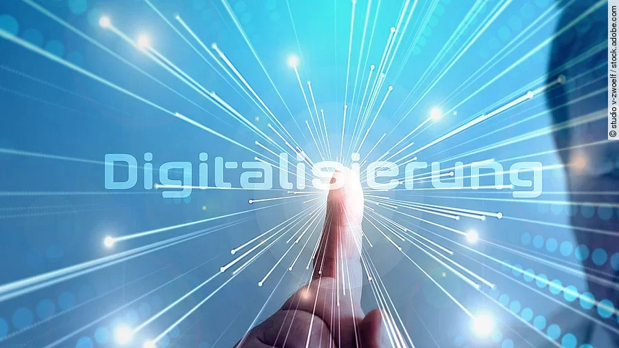 Grafik mit dem Wort "Digitalisierung" im Mittelpunkt. Lichtstrahlen gehen vom Mittelpunkt aus.
