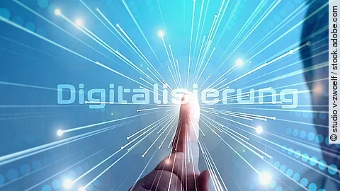 Grafik mit dem Wort "Digitalisierung" im Mittelpunkt. Lichtstrahlen gehen vom Mittelpunkt aus.