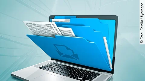 laptop with folders on the screen