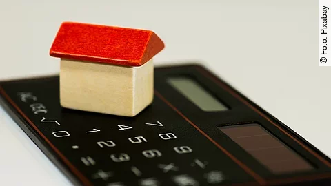 Taschenrechner Taschenrechner mit Holzhaus